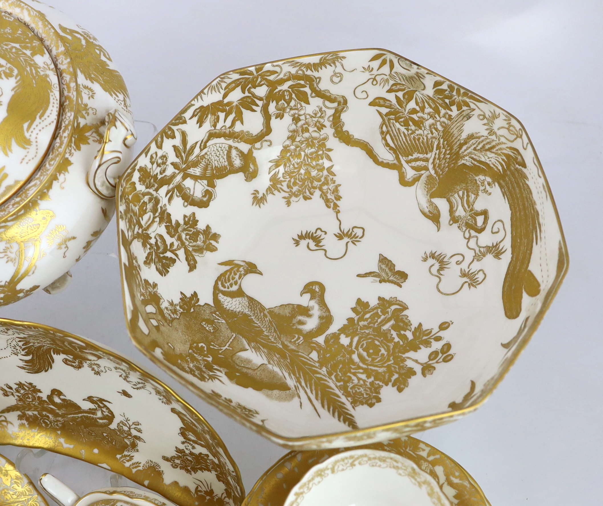 An extensive Royal Crown Derby Gold Aves dinner and tea service